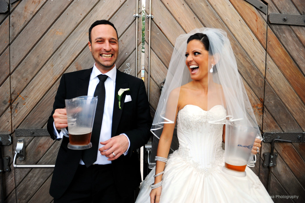 bride and groom with pitcher of beer